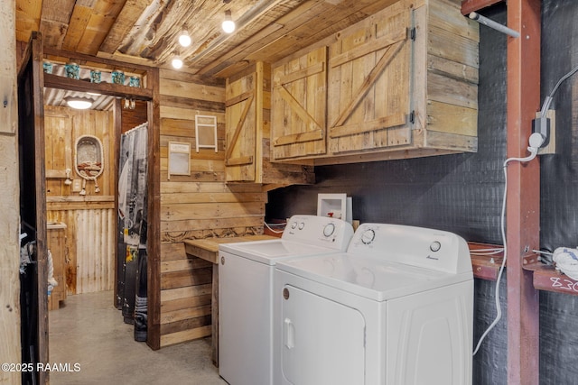 1054 Preston Broussard Rd, Arnaudville, LA 70512 - laundry room featuring washer and dryer, cabinet space, wooden walls, and wood ceiling