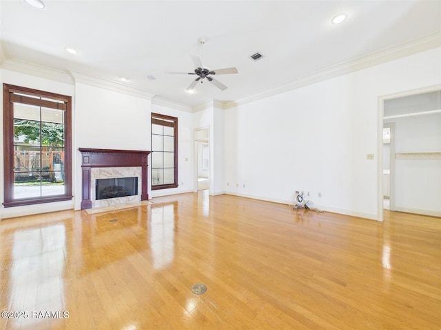 101 Lockeport Cir, Lafayette, LA 70508 - unfurnished living room with a ceiling fan, light wood-style floors, a high end fireplace, crown molding, and recessed lighting