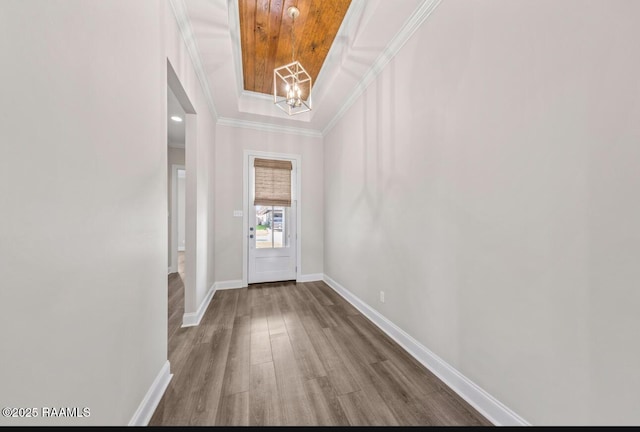 413 Easy Rock Landing Dr, Broussard, LA 70518 - entryway with a chandelier, wood finished floors, a raised ceiling, and crown molding