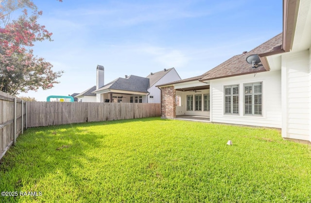 413 Easy Rock Landing Dr, Broussard, LA 70518 - fenced backyard with a ceiling fan and a patio