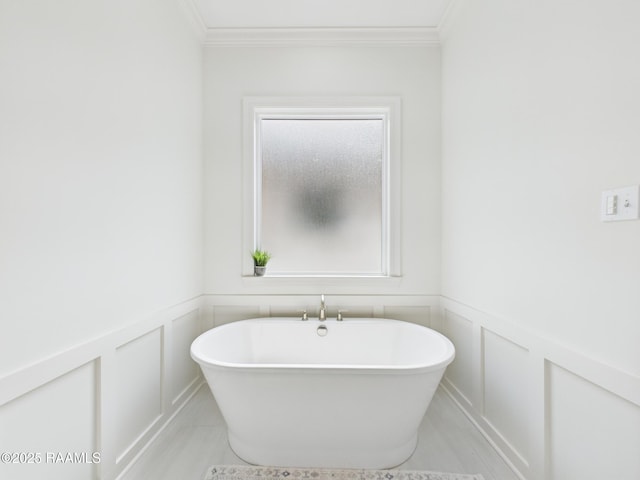 207 Timber Mill St, Lafayette, LA 70508 - bathroom featuring a freestanding tub, a decorative wall, crown molding, and wainscoting