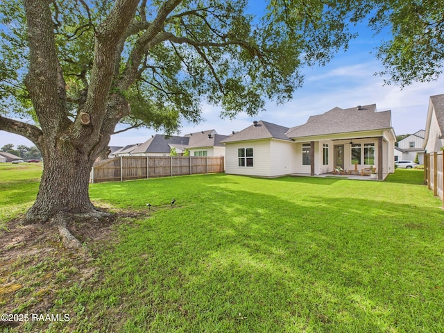 207 Timber Mill St, Lafayette, LA 70508 - fenced backyard featuring a patio area and a ceiling fan