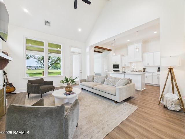 207 Timber Mill St, Lafayette, LA 70508 - living room with a ceiling fan, light wood-type flooring, high vaulted ceiling, and recessed lighting