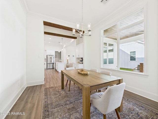 207 Timber Mill St, Lafayette, LA 70508 - dining space featuring a chandelier, light wood-style flooring, and ornamental molding
