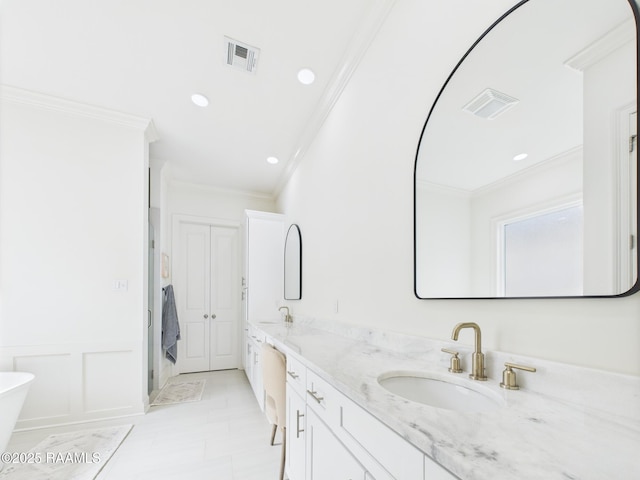 207 Timber Mill St, Lafayette, LA 70508 - bathroom featuring ornamental molding, double vanity, a soaking tub, and recessed lighting