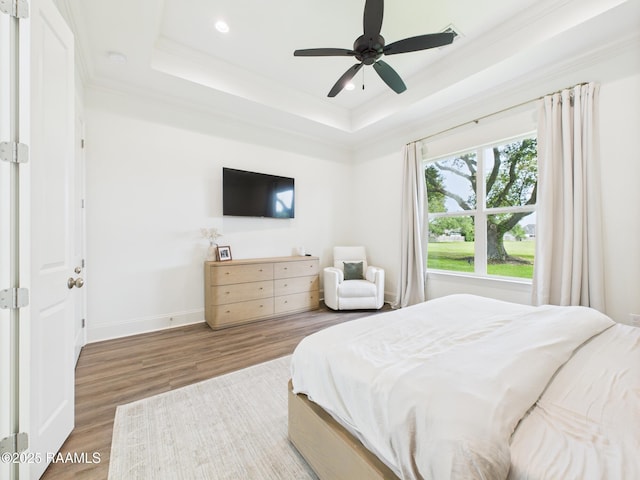 207 Timber Mill St, Lafayette, LA 70508 - bedroom featuring a raised ceiling, crown molding, wood finished floors, recessed lighting, and ceiling fan