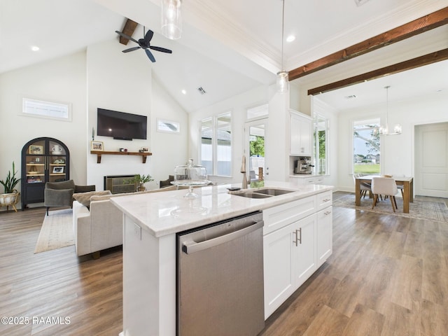 207 Timber Mill St, Lafayette, LA 70508 - kitchen with stainless steel dishwasher, beamed ceiling, open floor plan, wood finished floors, and decorative light fixtures