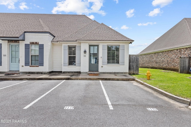 118 Rue Argenteuil, Lafayette, LA 70506 - view of property with uncovered parking and a shingled roof