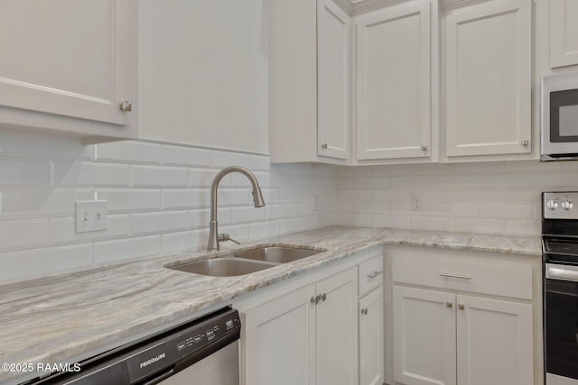 118 Rue Argenteuil, Lafayette, LA 70506 - kitchen with dishwasher, white cabinets, stove, and backsplash