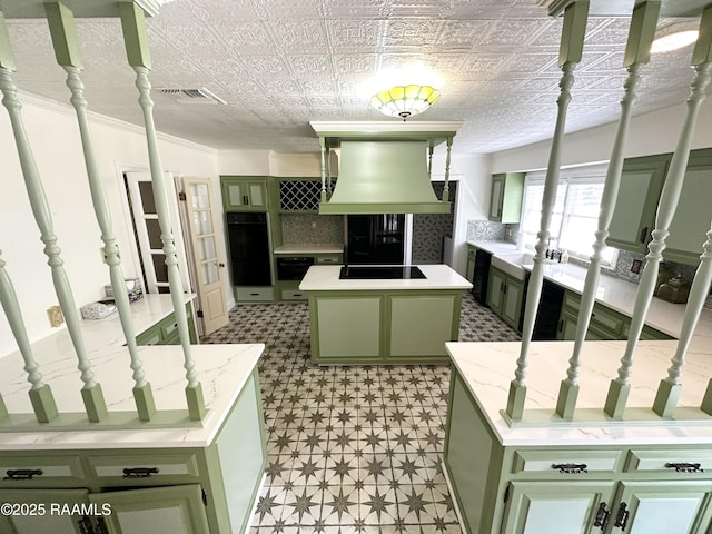 201 Edgewood Dr, Lafayette, LA 70503 - kitchen featuring green cabinetry, custom range hood, black appliances, light flooring, and a kitchen island