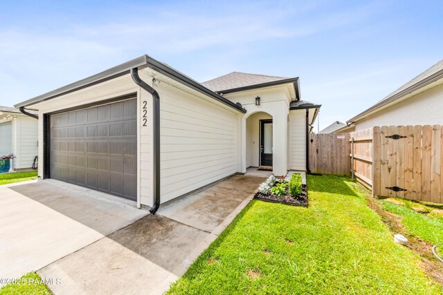 222 Alpine Dr, Lafayette, LA 70506 - view of front of house with driveway and a garage