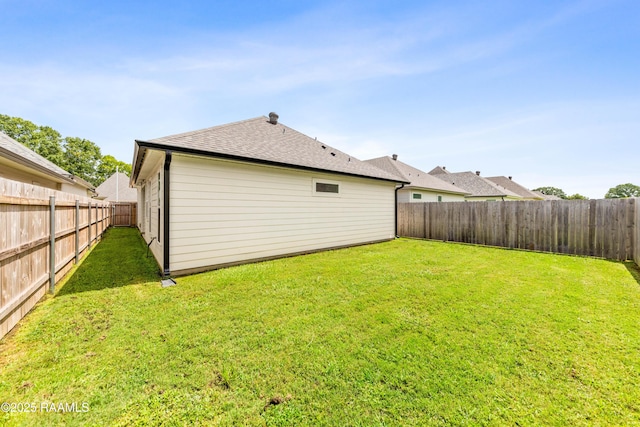 222 Alpine Dr, Lafayette, LA 70506 - back of property featuring a fenced backyard and a shingled roof