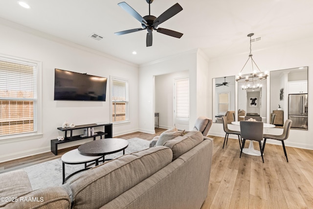 222 Alpine Dr, Lafayette, LA 70506 - living area with a ceiling fan, crown molding, a chandelier, light wood-type flooring, and recessed lighting