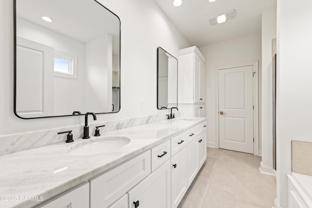 222 Alpine Dr, Lafayette, LA 70506 - bathroom featuring double vanity, tile patterned floors, and recessed lighting