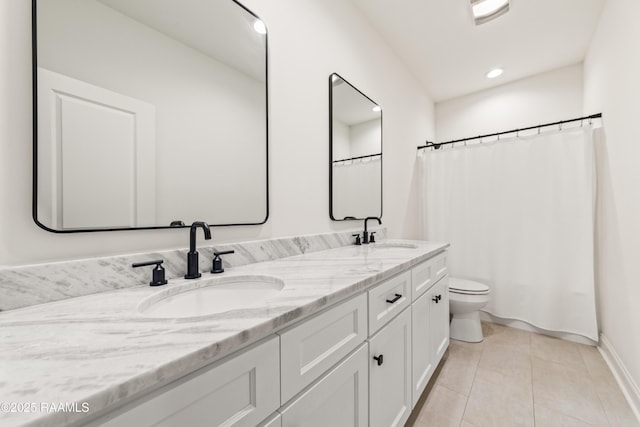 222 Alpine Dr, Lafayette, LA 70506 - full bath with double vanity, tile patterned floors, and recessed lighting