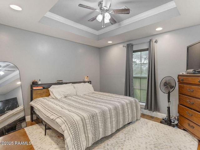 1166 Madeline Hts, Breaux Bridge, LA 70517 - bedroom with ornamental molding, a raised ceiling, wood finished floors, recessed lighting, and ceiling fan
