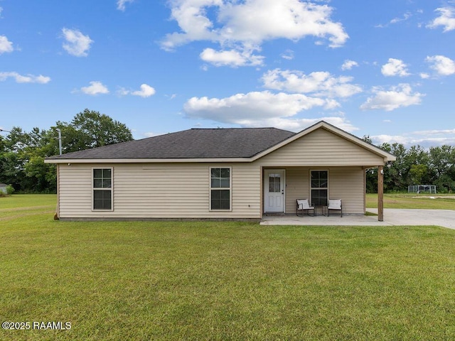 1166 Madeline Hts, Breaux Bridge, LA 70517 - view of front facade with a patio, a front lawn, and a shingled roof