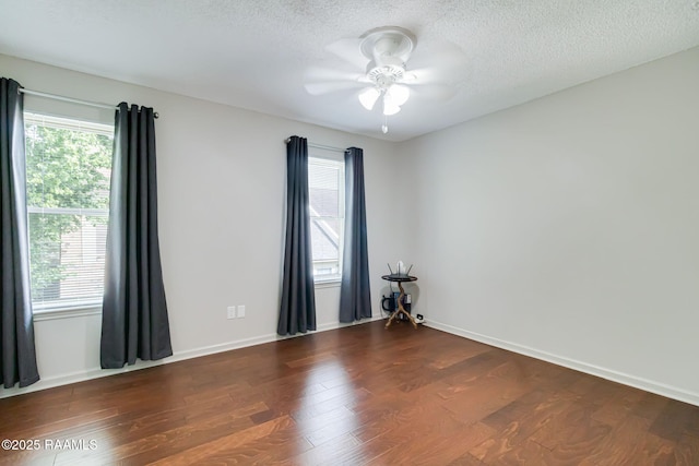 209 Long Plantation Unit A, Lafayette, LA 70508 - unfurnished room with plenty of natural light, dark wood finished floors, ceiling fan, and a textured ceiling