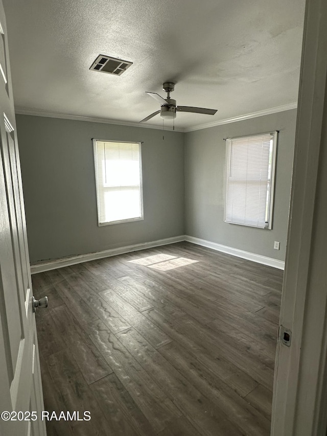 131 Justin St, Lafayette, LA 70501 - empty room with crown molding, a ceiling fan, dark wood-style flooring, and a textured ceiling