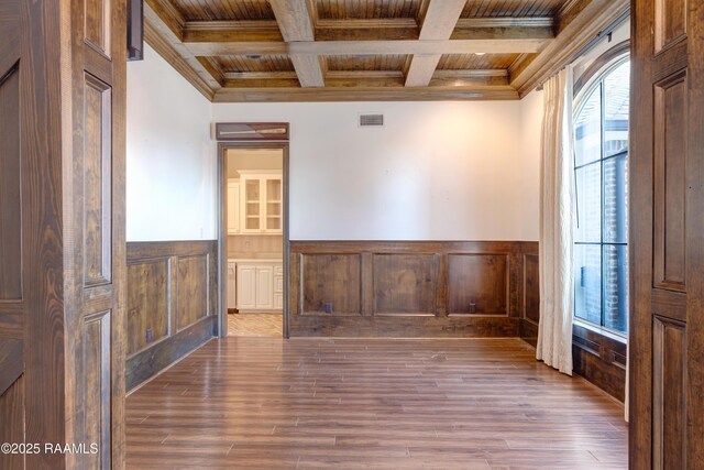 506 Terrell Ct, New Iberia, LA 70563 - unfurnished room with beam ceiling, ornamental molding, a wainscoted wall, coffered ceiling, and wood finished floors