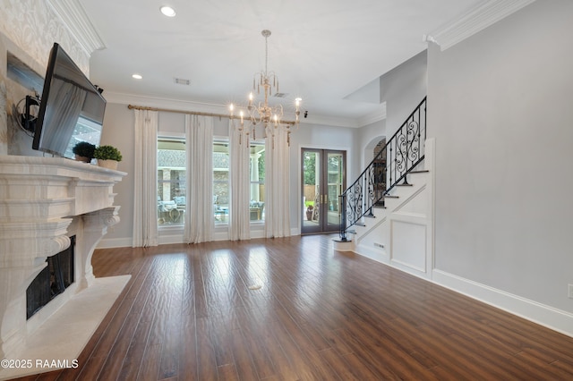 506 Terrell Ct, New Iberia, LA 70563 - unfurnished living room with a premium fireplace, a chandelier, stairway, ornamental molding, and recessed lighting