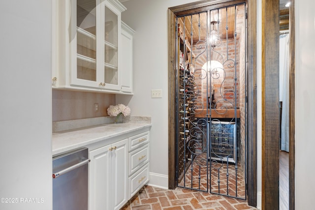 506 Terrell Ct, New Iberia, LA 70563 - wine area with brick flooring and baseboards
