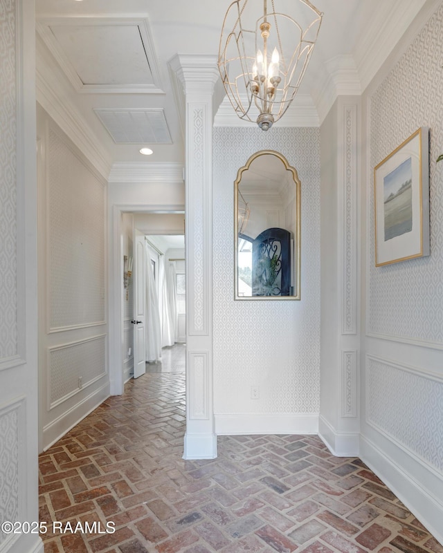 506 Terrell Ct, New Iberia, LA 70563 - corridor with brick flooring, crown molding, a chandelier, and wallpapered walls