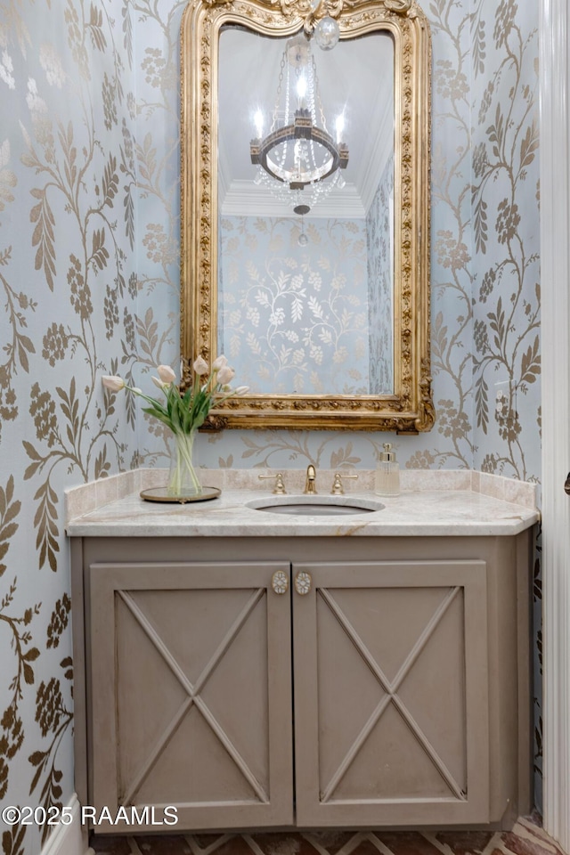 506 Terrell Ct, New Iberia, LA 70563 - bathroom featuring wallpapered walls, a chandelier, vanity, and ornamental molding