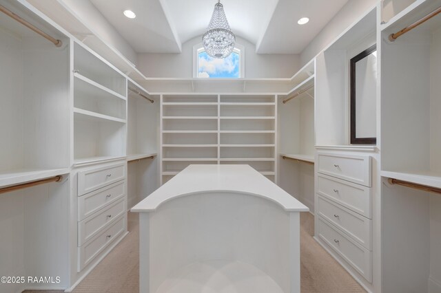 506 Terrell Ct, New Iberia, LA 70563 - walk in closet with vaulted ceiling, a chandelier, and light colored carpet