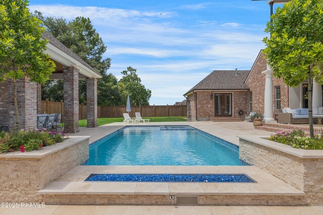 506 Terrell Ct, New Iberia, LA 70563 - view of swimming pool with a patio, an outdoor living space with a fire pit, french doors, and a fenced backyard
