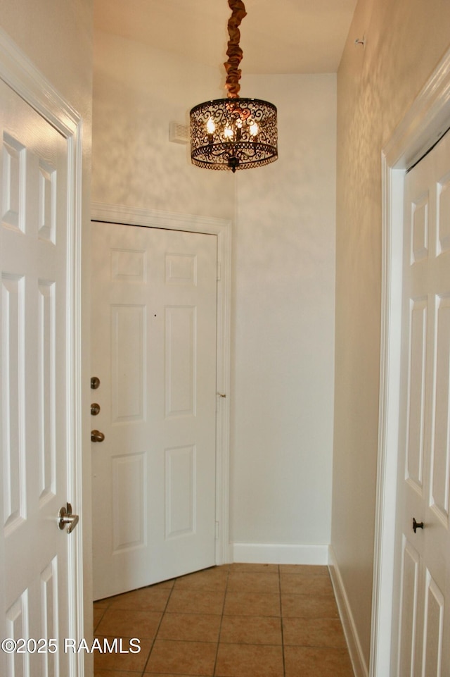 201 Settlers Trace Blvd Unit 2410, Lafayette, LA 70508 - tiled foyer with a chandelier and baseboards