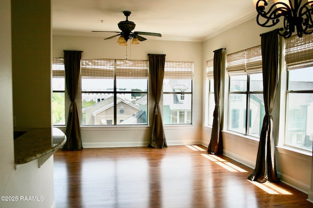 201 Settlers Trace Blvd Unit 2410, Lafayette, LA 70508 - unfurnished room featuring wood finished floors, ornamental molding, plenty of natural light, and a ceiling fan
