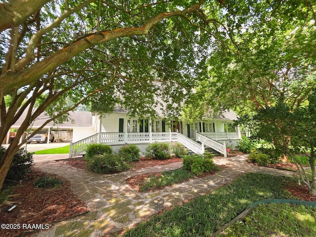 104 Running Deer Dr, Lafayette, LA 70503 - obstructed view of property with a porch and stairs
