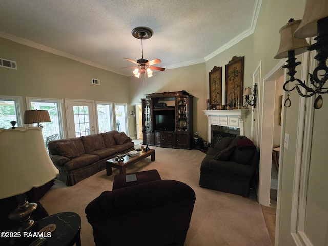 104 Running Deer Dr, Lafayette, LA 70503 - living room with carpet floors, a ceiling fan, ornamental molding, plenty of natural light, and a high end fireplace