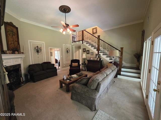 104 Running Deer Dr, Lafayette, LA 70503 - carpeted living area featuring stairway, crown molding, ceiling fan, plenty of natural light, and a fireplace