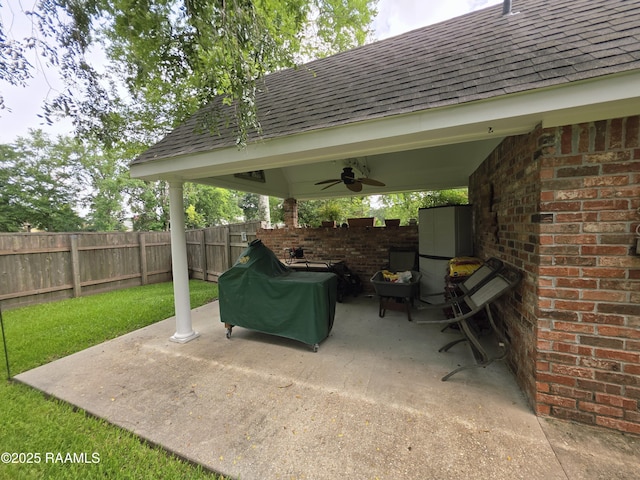 104 Running Deer Dr, Lafayette, LA 70503 - fenced backyard with a patio area, a ceiling fan, a gazebo, and grilling area
