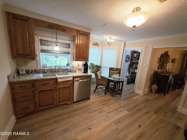 104 Running Deer Dr, Lafayette, LA 70503 - kitchen with stainless steel dishwasher, brown cabinets, a textured ceiling, ornamental molding, and light countertops