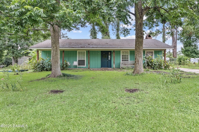 40 Hidden Hills Rd, Arnaudville, LA 70512 - single story home with a front lawn, a chimney, covered porch, and board and batten siding