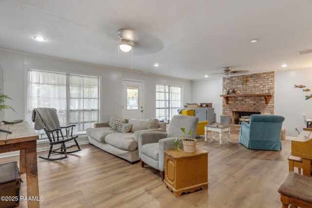 40 Hidden Hills Rd, Arnaudville, LA 70512 - living room with ceiling fan, a brick fireplace, ornamental molding, light wood-type flooring, and recessed lighting