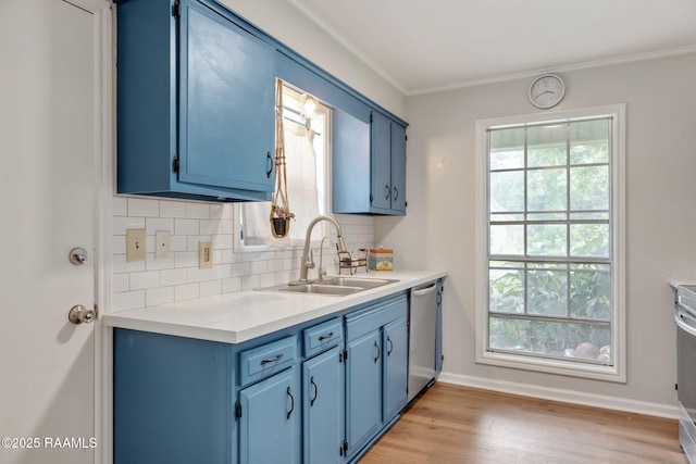 40 Hidden Hills Rd, Arnaudville, LA 70512 - kitchen with blue cabinetry, stainless steel dishwasher, tasteful backsplash, light countertops, and crown molding