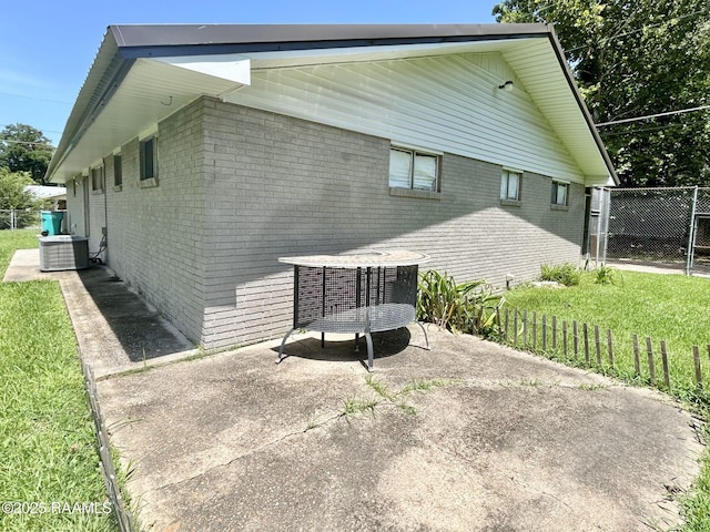 104 E Coleman St, Opelousas, LA 70570 - view of home's exterior with brick siding and a patio area