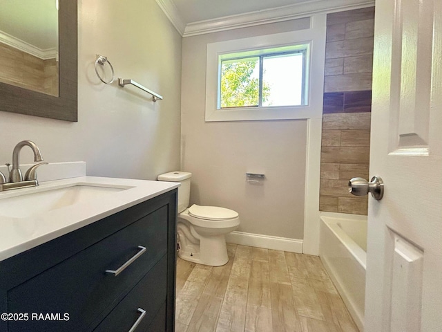 104 E Coleman St, Opelousas, LA 70570 - bathroom with crown molding, vanity, wood finished floors, and washtub / shower combination