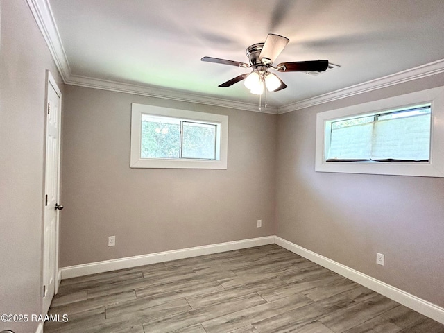 104 E Coleman St, Opelousas, LA 70570 - spare room featuring crown molding, a ceiling fan, and wood finished floors