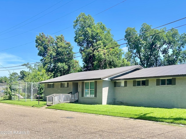 104 E Coleman St, Opelousas, LA 70570 - single story home with brick siding and a metal roof