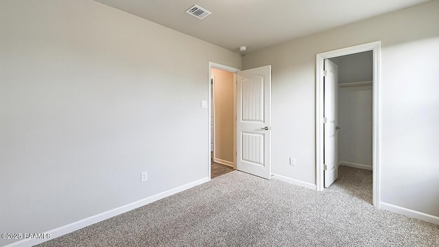 322 White Pine Dr, Lafayette, LA 70501 - unfurnished bedroom with carpet floors, a walk in closet, and a closet