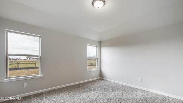 322 White Pine Dr, Lafayette, LA 70501 - carpeted empty room featuring baseboards and lofted ceiling