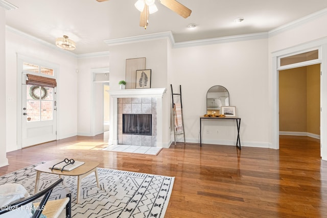 105 Clear Lake Dr, Lafayette, LA 70506 - living room featuring wood finished floors, a fireplace, ornamental molding, and ceiling fan