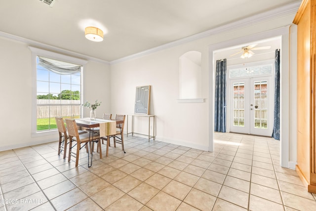 105 Clear Lake Dr, Lafayette, LA 70506 - dining space featuring light tile patterned flooring, crown molding, a ceiling fan, and french doors