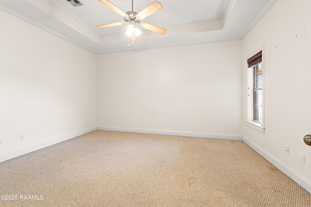 105 Clear Lake Dr, Lafayette, LA 70506 - unfurnished room with a raised ceiling, light colored carpet, ornamental molding, and a ceiling fan