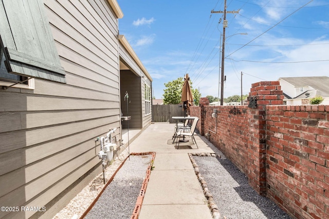 100 Serenity Sound Dr, Lafayette, LA 70506 - view of side of property featuring a patio area and a fenced backyard